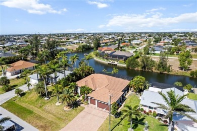 Paradise Found: Immaculate Waterfront Pool Home with TWO MASTER on Royal Tee Country Club in Florida - for sale on GolfHomes.com, golf home, golf lot