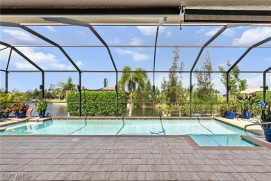 Paradise Found: Immaculate Waterfront Pool Home with TWO MASTER on Royal Tee Country Club in Florida - for sale on GolfHomes.com, golf home, golf lot