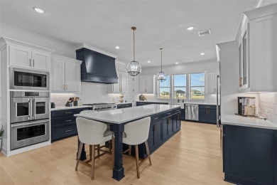 Experience true luxury in this breathtaking executive estate on The Golf Club at Resort Eagle Mountain Lake in Texas - for sale on GolfHomes.com, golf home, golf lot