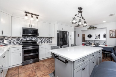 Experience the ultimate Florida lifestyle in this stunning home on Rotonda Golf and Country Club The Palms Course in Florida - for sale on GolfHomes.com, golf home, golf lot