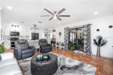 Experience the ultimate Florida lifestyle in this stunning home on Rotonda Golf and Country Club The Palms Course in Florida - for sale on GolfHomes.com, golf home, golf lot
