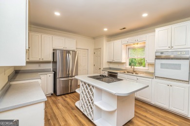 Step into your future in the beautiful Tamerlane neighborhood on Braelinn Golf Club in Georgia - for sale on GolfHomes.com, golf home, golf lot