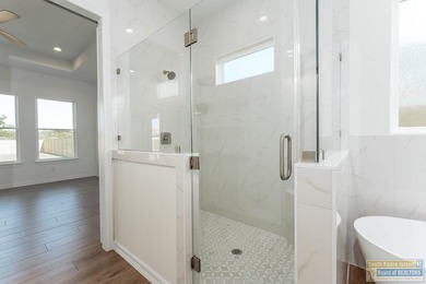 Discover luxury living with this stunning 3 bedroom, 2.5 bath, 1 on South Padre Island Golf Club in Texas - for sale on GolfHomes.com, golf home, golf lot