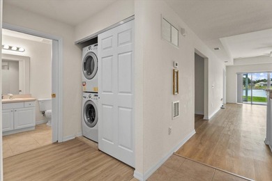 If you want relaxing, tranquil water views and beautiful sunsets on Sabal Trace Golf and Country Club in Florida - for sale on GolfHomes.com, golf home, golf lot