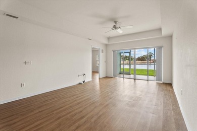 If you want relaxing, tranquil water views and beautiful sunsets on Sabal Trace Golf and Country Club in Florida - for sale on GolfHomes.com, golf home, golf lot