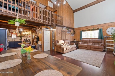 CONTEMPORARY LOG-SIDED CHALET, JUST A MINUTE OR TWO WALK TO THE on The Hideout Golf in Pennsylvania - for sale on GolfHomes.com, golf home, golf lot