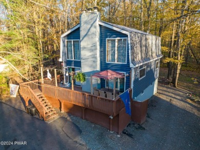 CONTEMPORARY LOG-SIDED CHALET, JUST A MINUTE OR TWO WALK TO THE on The Hideout Golf in Pennsylvania - for sale on GolfHomes.com, golf home, golf lot