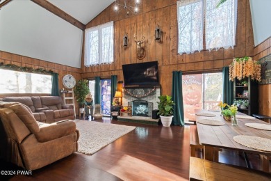 CONTEMPORARY LOG-SIDED CHALET, JUST A MINUTE OR TWO WALK TO THE on The Hideout Golf in Pennsylvania - for sale on GolfHomes.com, golf home, golf lot