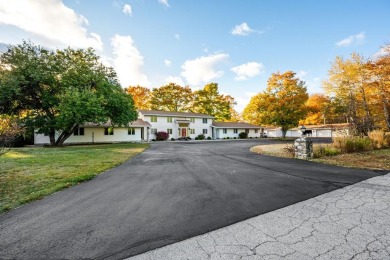 This first-floor unit offers a large living room with vaulted on Bay Ridge Golf Course in Wisconsin - for sale on GolfHomes.com, golf home, golf lot