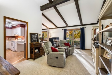 This first-floor unit offers a large living room with vaulted on Bay Ridge Golf Course in Wisconsin - for sale on GolfHomes.com, golf home, golf lot