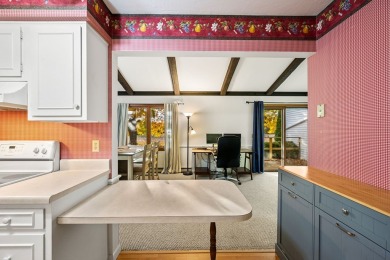 This first-floor unit offers a large living room with vaulted on Bay Ridge Golf Course in Wisconsin - for sale on GolfHomes.com, golf home, golf lot