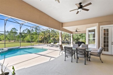 Your dream oasis awaits in this 5BR/3.5BA custom home with on Wedgefield Golf Club in Florida - for sale on GolfHomes.com, golf home, golf lot