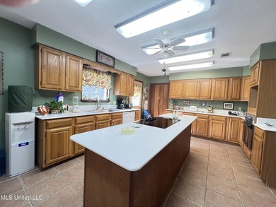 Prime Golf Course Living in Diamondhead | Wake up to sweeping on Diamondhead Country Club in Mississippi - for sale on GolfHomes.com, golf home, golf lot