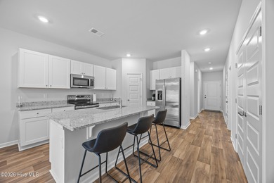 Elegantly appointed resale townhome located in The Hamptons at on Brunswick Plantation and Golf Resorts in North Carolina - for sale on GolfHomes.com, golf home, golf lot