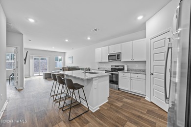 Elegantly appointed resale townhome located in The Hamptons at on Brunswick Plantation and Golf Resorts in North Carolina - for sale on GolfHomes.com, golf home, golf lot