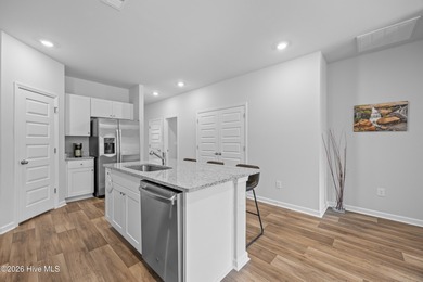 Elegantly appointed resale townhome located in The Hamptons at on Brunswick Plantation and Golf Resorts in North Carolina - for sale on GolfHomes.com, golf home, golf lot