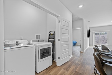 Elegantly appointed resale townhome located in The Hamptons at on Brunswick Plantation and Golf Resorts in North Carolina - for sale on GolfHomes.com, golf home, golf lot