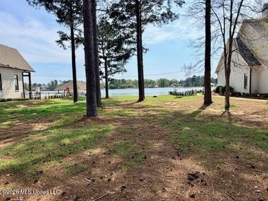 Prime waterfront lot in Lake Caroline ready for you to build on Lake Caroline Golf Club in Mississippi - for sale on GolfHomes.com, golf home, golf lot