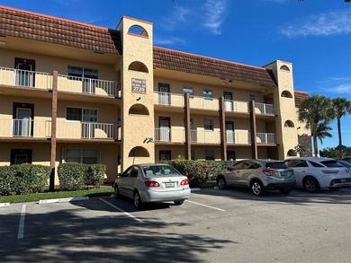 Spacious 2-bedroom, 2-bath first-floor condo in Sunrise Lakes on Sunrise Lakes Phase III in Florida - for sale on GolfHomes.com, golf home, golf lot