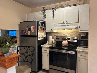 Spacious 2-bedroom, 2-bath first-floor condo in Sunrise Lakes on Sunrise Lakes Phase III in Florida - for sale on GolfHomes.com, golf home, golf lot