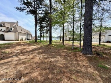 Prime waterfront lot in Lake Caroline ready for you to build on Lake Caroline Golf Club in Mississippi - for sale on GolfHomes.com, golf home, golf lot