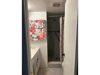 Spacious 2-bedroom, 2-bath first-floor condo in Sunrise Lakes on Sunrise Lakes Phase III in Florida - for sale on GolfHomes.com, golf home, golf lot