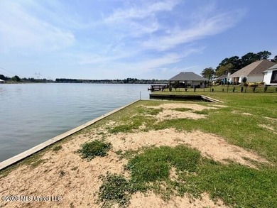 Prime waterfront lot in Lake Caroline ready for you to build on Lake Caroline Golf Club in Mississippi - for sale on GolfHomes.com, golf home, golf lot