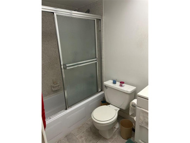 Spacious 2-bedroom, 2-bath first-floor condo in Sunrise Lakes on Sunrise Lakes Phase III in Florida - for sale on GolfHomes.com, golf home, golf lot