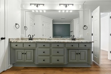 This traditional home located on a quiet street in the Country on The Country Club of Arkansas in Arkansas - for sale on GolfHomes.com, golf home, golf lot