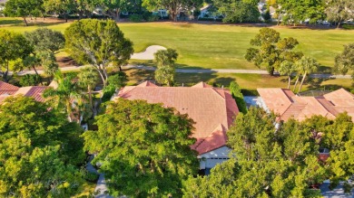 This retreat in the village of Cedar Cay blends its on Broken Sound Golf and Club  in Florida - for sale on GolfHomes.com, golf home, golf lot