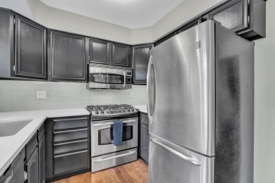 Beautifully updated townhome w/ Canadian maple hardwood floors on Georgetown Country Club in Michigan - for sale on GolfHomes.com, golf home, golf lot