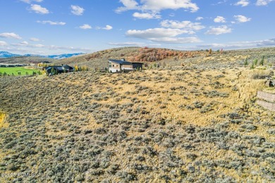 An exceptional homesite overlooking the lake and first hole of on Promontory Nicklaus Painted Valley Golf Course in Utah - for sale on GolfHomes.com, golf home, golf lot