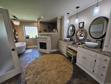 This stunning home truly has it all! Featuring 4 spacious on Foxwood Golf Club in Arkansas - for sale on GolfHomes.com, golf home, golf lot