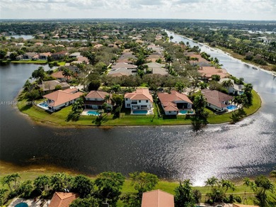 Experience luxury living in Weston Hills, a premier gated golf on Weston Hills Country Club in Florida - for sale on GolfHomes.com, golf home, golf lot
