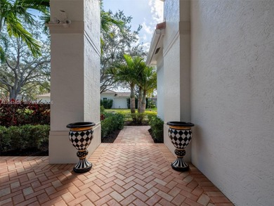 Experience luxury living in Weston Hills, a premier gated golf on Weston Hills Country Club in Florida - for sale on GolfHomes.com, golf home, golf lot