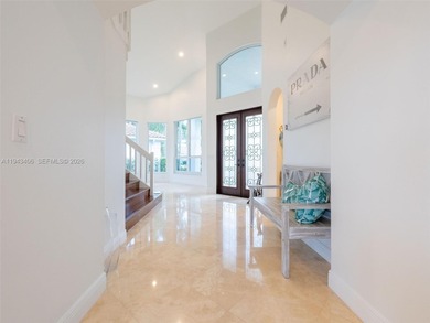 Experience luxury living in Weston Hills, a premier gated golf on Weston Hills Country Club in Florida - for sale on GolfHomes.com, golf home, golf lot