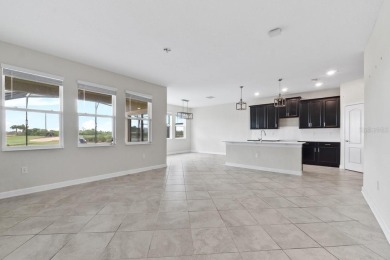 Modern living awaits in this stunning 4-bedroom, 3-bathroom home on ChampionsGate Golf Resort in Florida - for sale on GolfHomes.com, golf home, golf lot