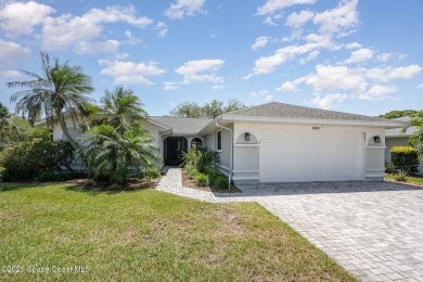 Gorgeous paver driveway and lush landscaping greet you as you on Indian River Colony Club in Florida - for sale on GolfHomes.com, golf home, golf lot