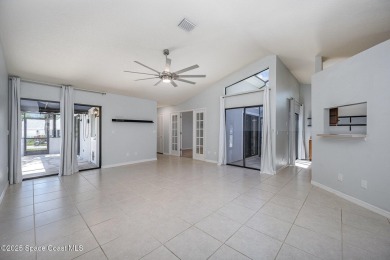 Gorgeous paver driveway and lush landscaping greet you as you on Indian River Colony Club in Florida - for sale on GolfHomes.com, golf home, golf lot