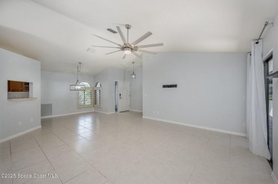 Gorgeous paver driveway and lush landscaping greet you as you on Indian River Colony Club in Florida - for sale on GolfHomes.com, golf home, golf lot