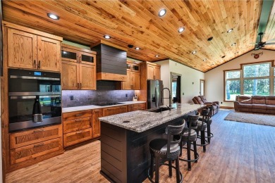 Experience luxury living in this masterfully crafted 2024 built on Blueberry Pines Golf CLub in Minnesota - for sale on GolfHomes.com, golf home, golf lot