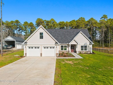 Stunning custom 3 bedroom, 3 bathroom plus a bonus room home in on Carolina Shores Golf Course in North Carolina - for sale on GolfHomes.com, golf home, golf lot