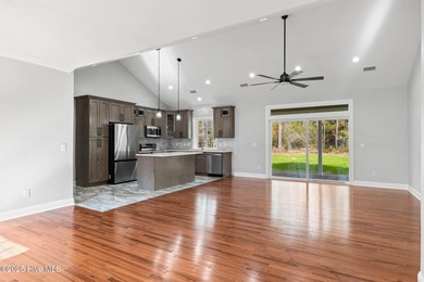 Stunning custom 3 bedroom, 3 bathroom plus a bonus room home in on Carolina Shores Golf Course in North Carolina - for sale on GolfHomes.com, golf home, golf lot