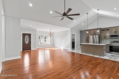 Stunning custom 3 bedroom, 3 bathroom plus a bonus room home in on Carolina Shores Golf Course in North Carolina - for sale on GolfHomes.com, golf home, golf lot