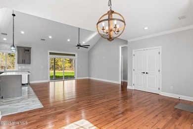 Stunning custom 3 bedroom, 3 bathroom plus a bonus room home in on Carolina Shores Golf Course in North Carolina - for sale on GolfHomes.com, golf home, golf lot