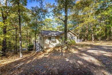 Discover your own slice of paradise with this secluded home on Mountain Ranch Golf Club in Arkansas - for sale on GolfHomes.com, golf home, golf lot