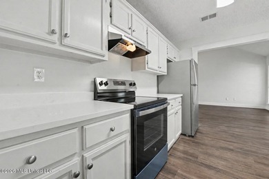 This cozy Diamondhead gem has been beautifully renovated and is on Diamondhead Country Club in Mississippi - for sale on GolfHomes.com, golf home, golf lot