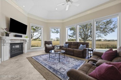 Custom elegant home offers a grand entry flowing into spacious on Marsh Landing Country Club - Saint Johns County in Florida - for sale on GolfHomes.com, golf home, golf lot