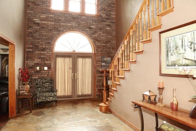 Welcome to 10812 Bay Ridge Drive -- a beautiful two-story home on Lions Den Golf Club in Arkansas - for sale on GolfHomes.com, golf home, golf lot