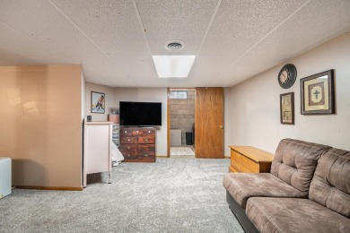 Stunning 2-story home features vaulted ceilings and a spacious on Hankerd Hills Golf Course in Michigan - for sale on GolfHomes.com, golf home, golf lot
